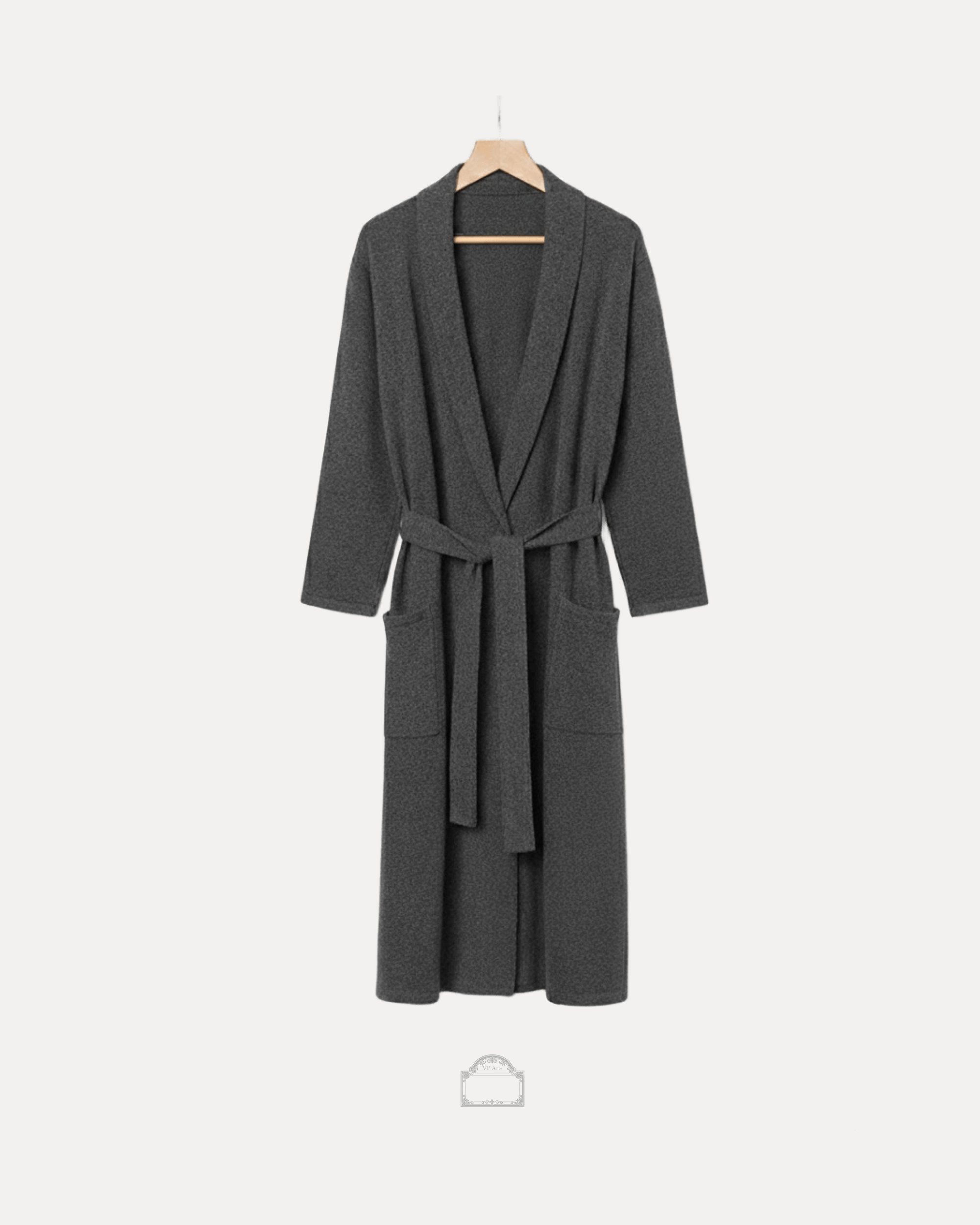Grey cachemire bathrobe hanging with a tie belt, showcasing elegance and comfort in luxurious fabric.