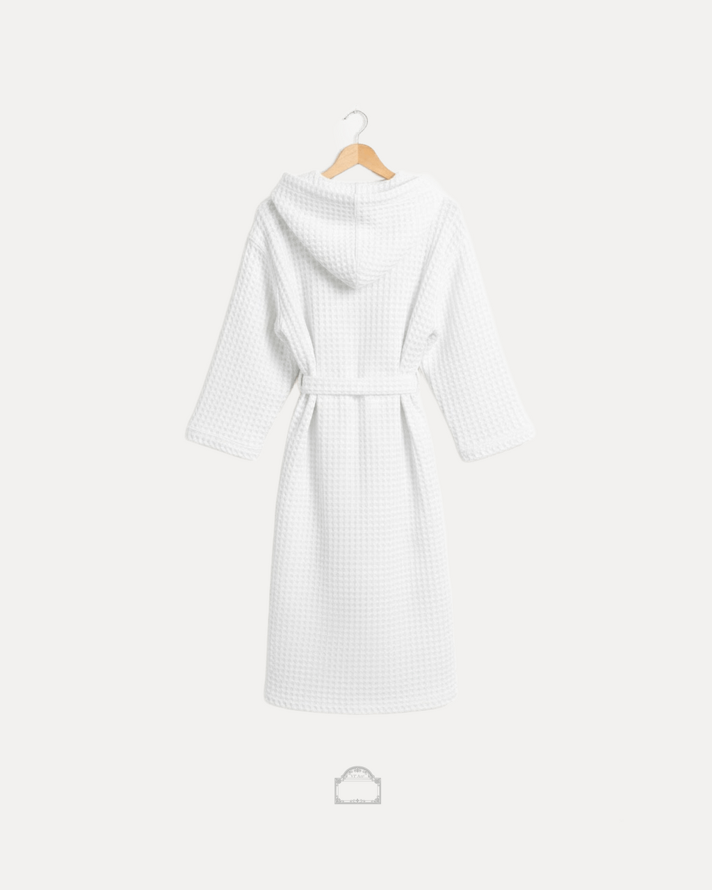 Back view of white waffle bathrobe with hood and belt